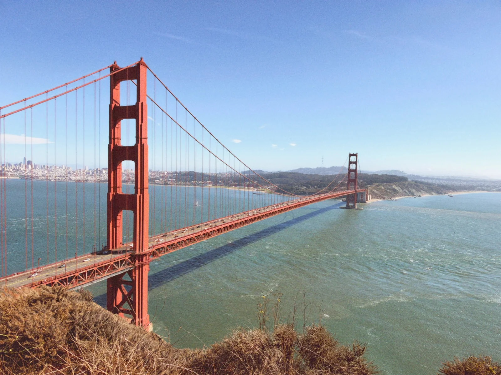 Personal photograph of San Francisco's Golden Gate Bridge, photographed from above the shoreline